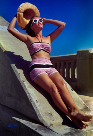 Photo showing: In the Pink. -- February 1944. Florida Fashion: Sherley in pink bathing suit.