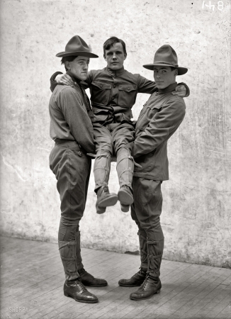 Photo showing: In Good Hands -- 1912. Boy Scout Training demonstration, first aid to the injured.