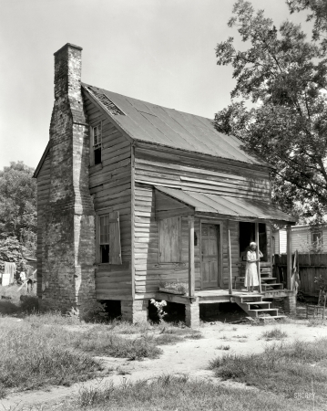 Photo showing: The Comforts of Home -- Baldwin County, Georgia circa 1944. Former slave cabin, Milledgeville vicinity.