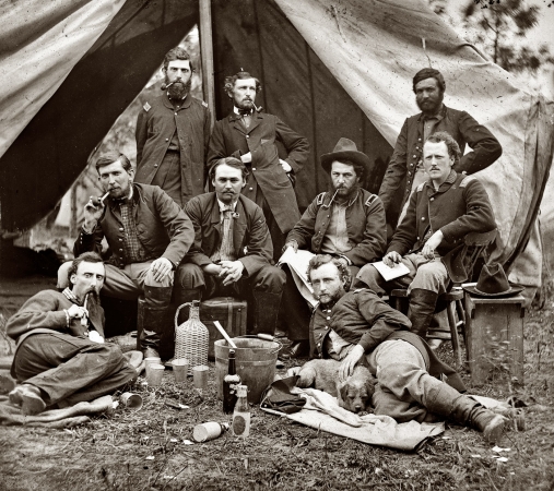 Photo showing: Lt. Custer and Pvt. Pup -- May 20, 1862. The Peninsula, Va. Staff of Gen. Fitz-John Porter; Lts. William G. Jones and George A. Custer reclining.