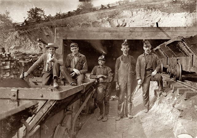 Photo showing: Laura Mine -- Bank Boss (on right), Brake Boy (in center). Laura Mine, Red Star, West Virginia. September 1908. 