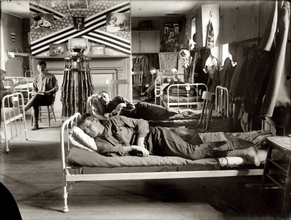 Photo showing: Caught Napping -- Company F, 12th Infantry. Soldiers in their bunks on Governor's Island, N.Y., circa 1908.
