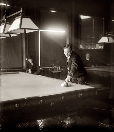 Photo showing: A Shot in the Dark -- January 1909. Billiards champion Calvin Demarest in New York.
