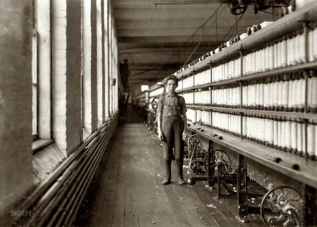 Photo showing: Jo Bodeon -- May 1909. Burlington, Vermont. Jo Bodeon, a 'back-roper' in the mule room, Chace Cotton Mill.