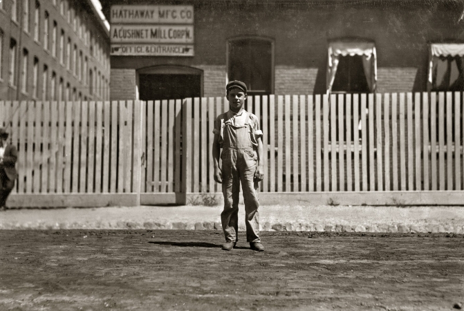 Photo showing: Acushnet Mill -- August 1911. New Bedford, Mass. Lewis Grace, 68 Acushnet Avenue. Probably 14. Works in drawing-in room.