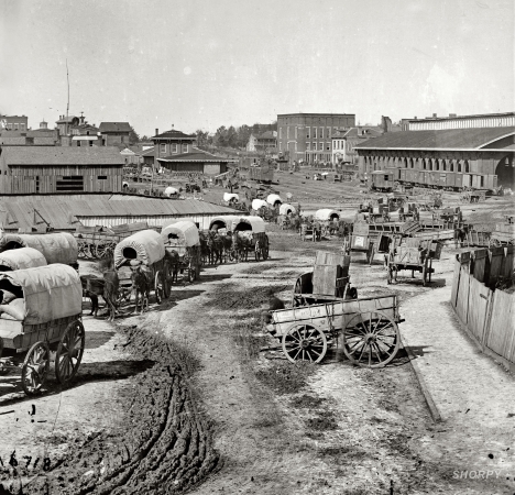 Photo showing: Atlanta 1864 -- Federal Army wagons at railroad depot.