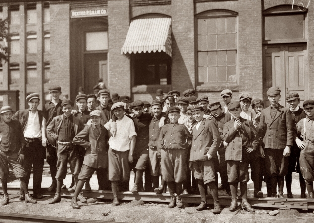Photo showing: Our Gang -- September 1911. Young workers in front of Indian Orchard Mfg. Co. Indian Orchard, Mass.