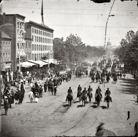 Photo showing: Civil War Washington -- Artillery unit passing on Pennsylvania Avenue near the Treasury, Washington, D.C. May 1865.