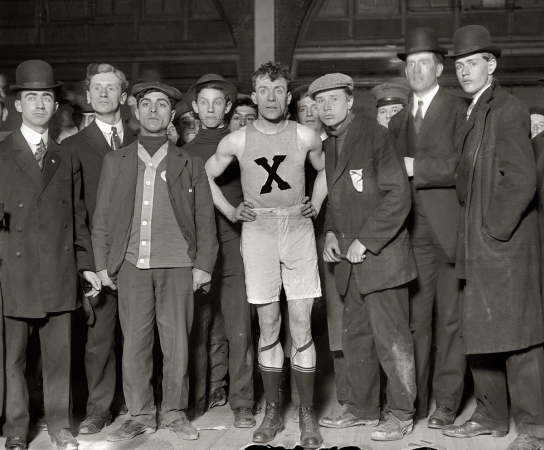 Photo showing: X-Man -- February 12, 1909. James Clarke, winner of Brooklyn Marathon, with others.