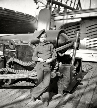 Photo showing: Powder Monkey -- Circa 1864-65. Powder monkey by gun of U.S.S. New Hampshire, Federal depot ship off Charleston, South Carolina.