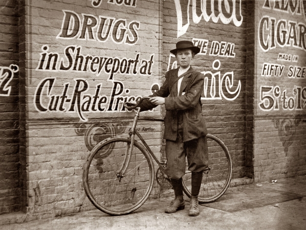 Photo showing: Howard the Delivery Boy -- November 1913. Shreveport, Louisiana. Howard Williams, 13-year-old delivery boy for Shreveport Drug Co. Goes to the Red Light every day and night.
