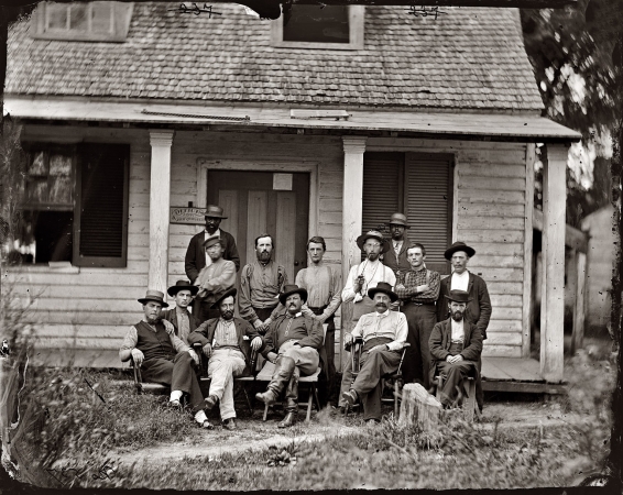 Photo showing: Petersburg: 1864 -- August 1864. Petersburg, North Carolina. Group at headquarters of the Provost Marshal Department.