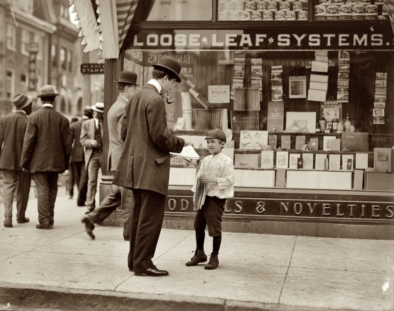 Photo showing: Paper, Mister? -- May 1910. Wilmington, Delaware. Newsboy, age 12. Doesn't smoke. Visits saloons. Works 7 hours per day.