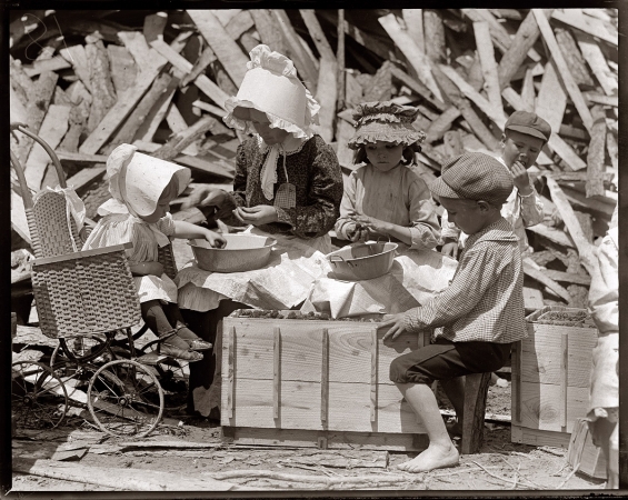 Photo showing: Berry Hullers -- May 1910. Seaford, Delaware. Mother and children hulling strawberries at Johnson's Hulling Station.