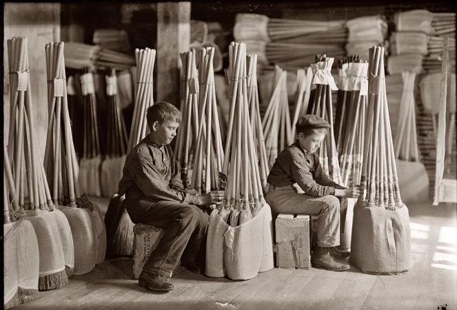 Photo showing: Room of Brooms -- October 1908. Evansville, Indiana. Boys with brooms. Packing room of S.W. Brown Manufacturing.