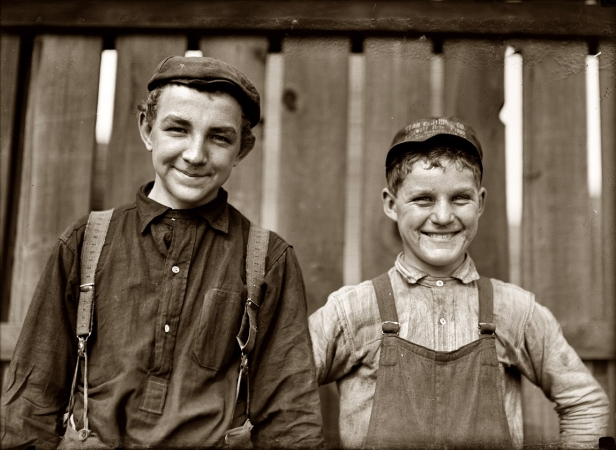 Photo showing: South Bend Mill Boys -- October 1908. South Bend, Indiana. Going home to lunch! Two boys from Singer Manufacturing Company.