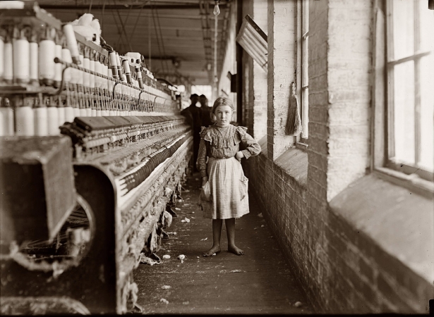 Photo showing: Little Spinner -- January 1909. A little spinner in a Georgia cotton mill.