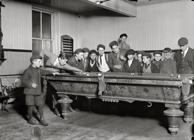 Photo showing: Pool Boys -- March 1909. One way to control the street boys. A common scene in the Bancroft-Foote Boys Club, New Haven, Connecticut.  