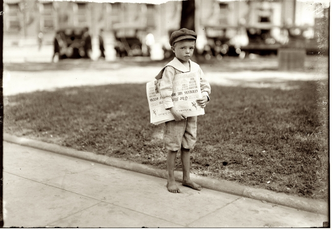 Photo showing: The Littlest Newsie -- Mobile, Alabama October 1914. Seven-year-old Ferris. Did not know enough to make change for the investigator.