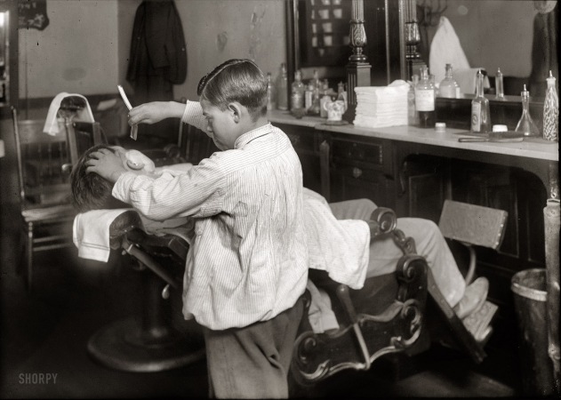 Photo showing: Boy Barber -- February 1, 1917. Boston, Mass. Frank De Natale, a 12-year old barber. Lathers and shaves
customers in father's shop, 416 Hanover Street, after school and Saturday.