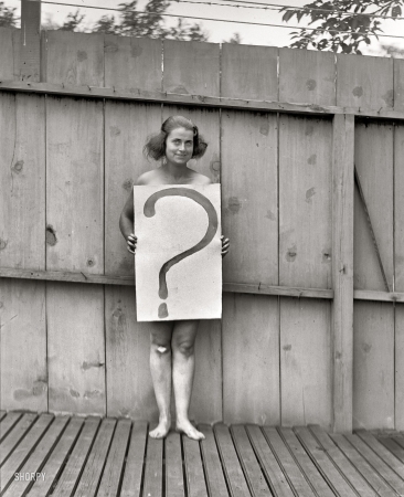 Photo showing: Possibly Naked? -- July 28, 1922. Washington, D.C. Unclothed woman behind '?' sign.