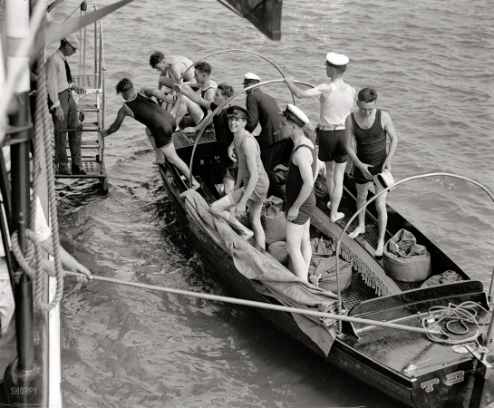 Photo showing: Shutterbugs Ahoy -- White House photographers, August 6, 1922. Possibly a recreational outing on the Potomac.