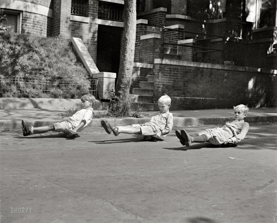 Photo showing: Skater Dudes -- September 15, 1922. Washington, D.C. Scooter skates.