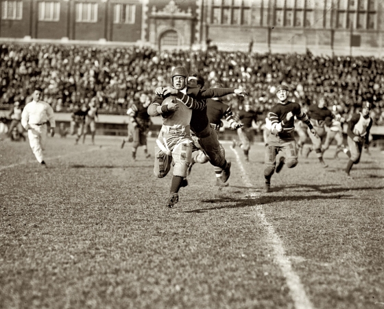 Photo showing: Flying Tackle -- November 3, 1923. High school football in Washington, D.C.: Eastern vs. Central.