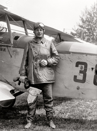 Photo showing: Par Avion -- May 1918. Washington, D.C. Air Mail, inauguration of service, polo grounds. Maj. R.H. Fleet beside Curtiss JN46H plane.