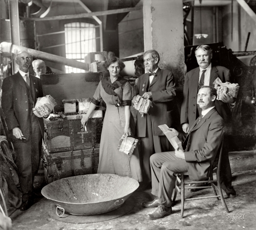 Photo showing: The Money Killers -- Maceration of old currency, Bureau of Printing and Engraving Destruction Committee, Washington, circa 1912.