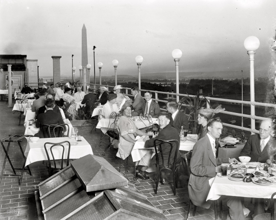 Photo showing: Monumental Meals -- Rooftop dining somewhere near the Washington Monument circa 1920.