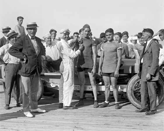 Photo showing: Pinning a Winner -- July 18, 1925. Laurel, Maryland. Race car driver Peter De Paolo and Chas. Allen.