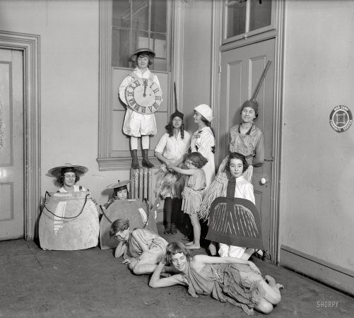 Photo showing: The Kitchen Clock -- Washington, D.C., circa 1918. Apparently a children's play.