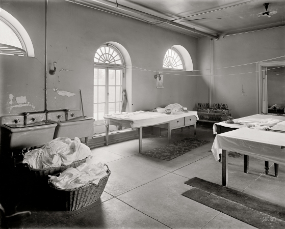 Photo showing: White House Laundry -- Washington, D.C. With an April 1909 calendar on the wall and a brace of flatirons in the corner.