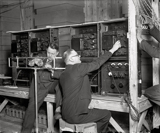 Photo showing: Throwing the Switch -- February 27, 1929. Washington, D.C. Testing installation for radio broadcast of the Hoover Inauguration.