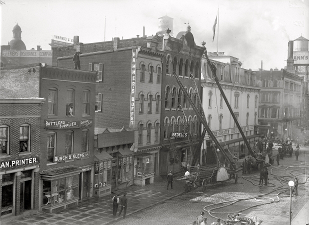 Photo showing: The Smoking Bed -- October 23, 1915. Washington, D.C. Bedell fire, Seventh & D streets. Bedell Manufacturing made mattresses.