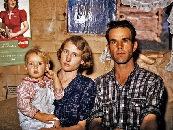 Photo showing: Pie Town Homesteaders -- 1940. Jack Whinery, Pie Town, New Mexico, homesteader, with his wife and youngest child in their dugout home.