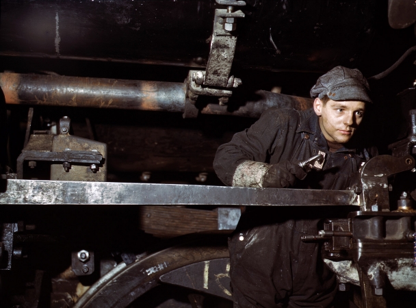 Photo showing: Making the Trains Run -- December 1942. A young worker at the Chicago & North Western 40th Street shops.