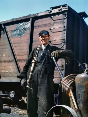 Photo showing: Mike the Welder -- Chicago, April 1943. Mike Evans, a welder, at the rip tracks of the Proviso Yard, Chicago & North Western R.R.