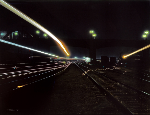 Photo showing: Trainlight: 1943 -- Time exposure of locomotive headlights and switchmen's lamps. Santa Fe R.R. yard, Los Angeles, Calif.