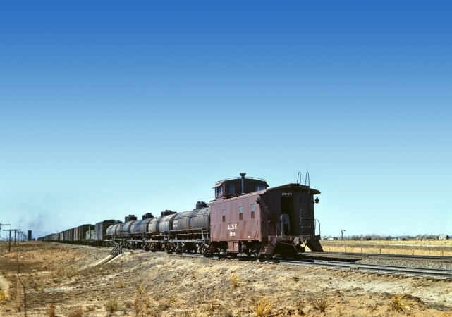 Photo showing: Westbound Freight -- Santa Fe R.R. westbound freight stopping for water at Melrose, New Mexico.