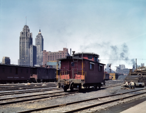 Photo showing: Single, Looking to Hook Up -- Chicago, April 1943. Chesapeake & Ohio R.R. caboose, Illinois Central Railroad freight depot.
