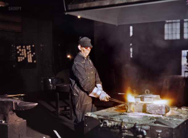 Photo showing: The Blacksmith: 1943 -- Blue Island, Illinois. John Kelseh, blacksmith, at his forge in the blacksmith shop at the roundhouse, Rock Island R.R.