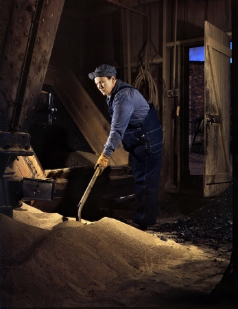 Photo showing: Mrs. Sandman: 1943 -- Mrs. Thelma Cuvage, working in the sand house at the Chicago & North Western R.R. roundhouse at Clinton, Iowa.
