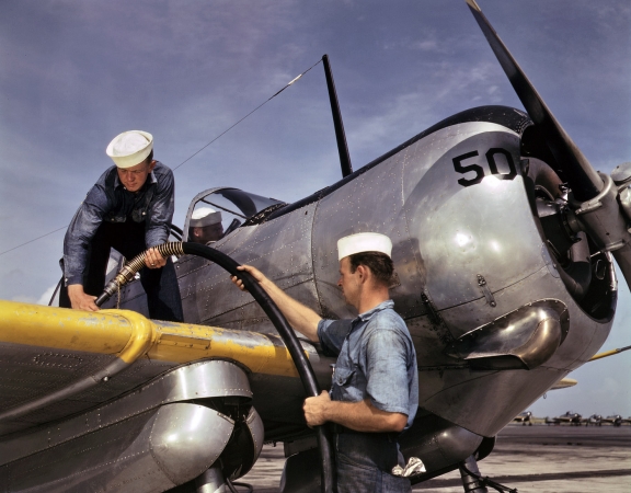 Photo showing: High Octane: 1942 -- Feeding an SNC advanced training plane is done by sailor mechanics at the Naval Air Base, Corpus Christi, Texas.