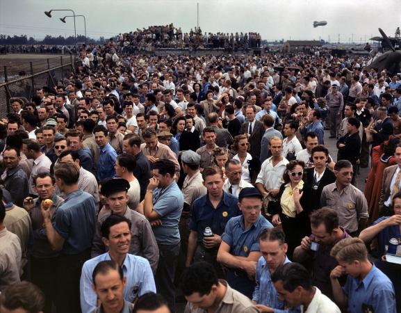 Photo showing: Wartime Workforce -- October 1942. North American Aviation employees at Inglewood, California during a lunch period air show.