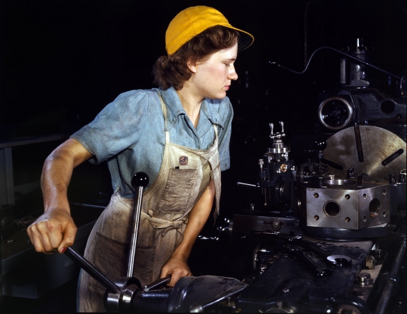 Photo showing: Lathe Operator -- October 1942. Lathe operator machining parts for transport planes at the Consolidated Aircraft plant in Fort Worth, Texas.