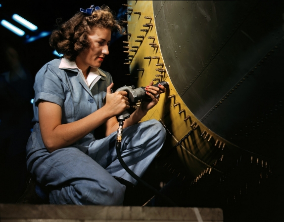 Photo showing: Riveting Rosie -- Riveter at work on a bomber, Consolidated Aircraft factory, Fort Worth, 1942.