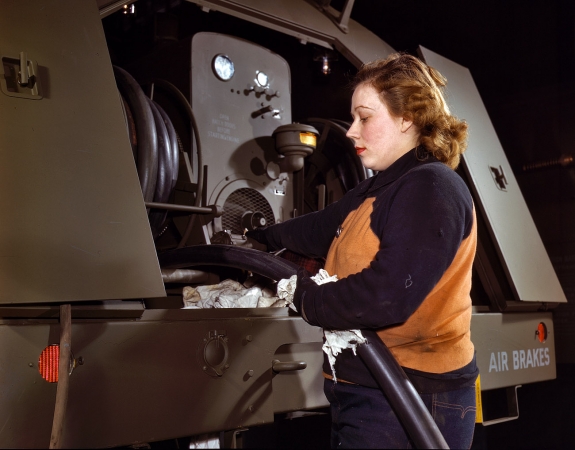 Photo showing: Agnes of Milwaukee: 1943 -- Agnes Cliemka checking fuel hose on gasoline trailer at Heil & Co. before it is turned over to the Air Force.