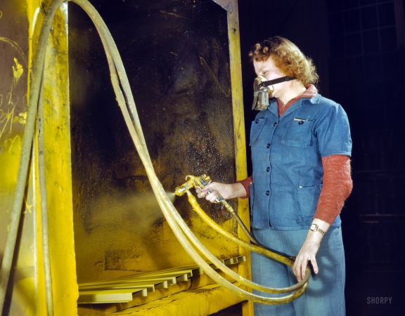 Photo showing: Primary Colors: 1943 -- Elizabeth Little, mother of two, spraying small parts for Army Air Corps gasoline trailer tanks, Heil Co, Milwaukee.